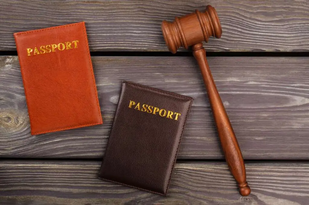 Wooden gavel and passports.
